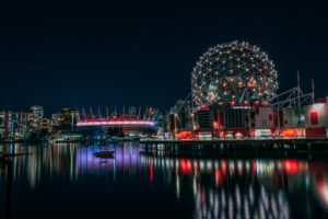 Vancouver water view at night of BC Place and Science World