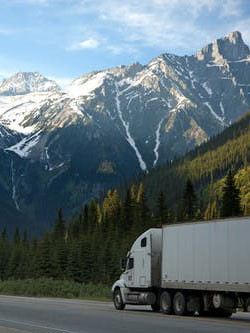 Moving truck driving through the Rockie Mountains